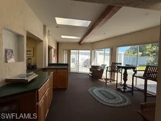 a room with furniture and a large window