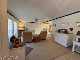 a kitchen with furniture a refrigerator and a sink