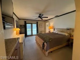 a spacious bedroom with a bed and window