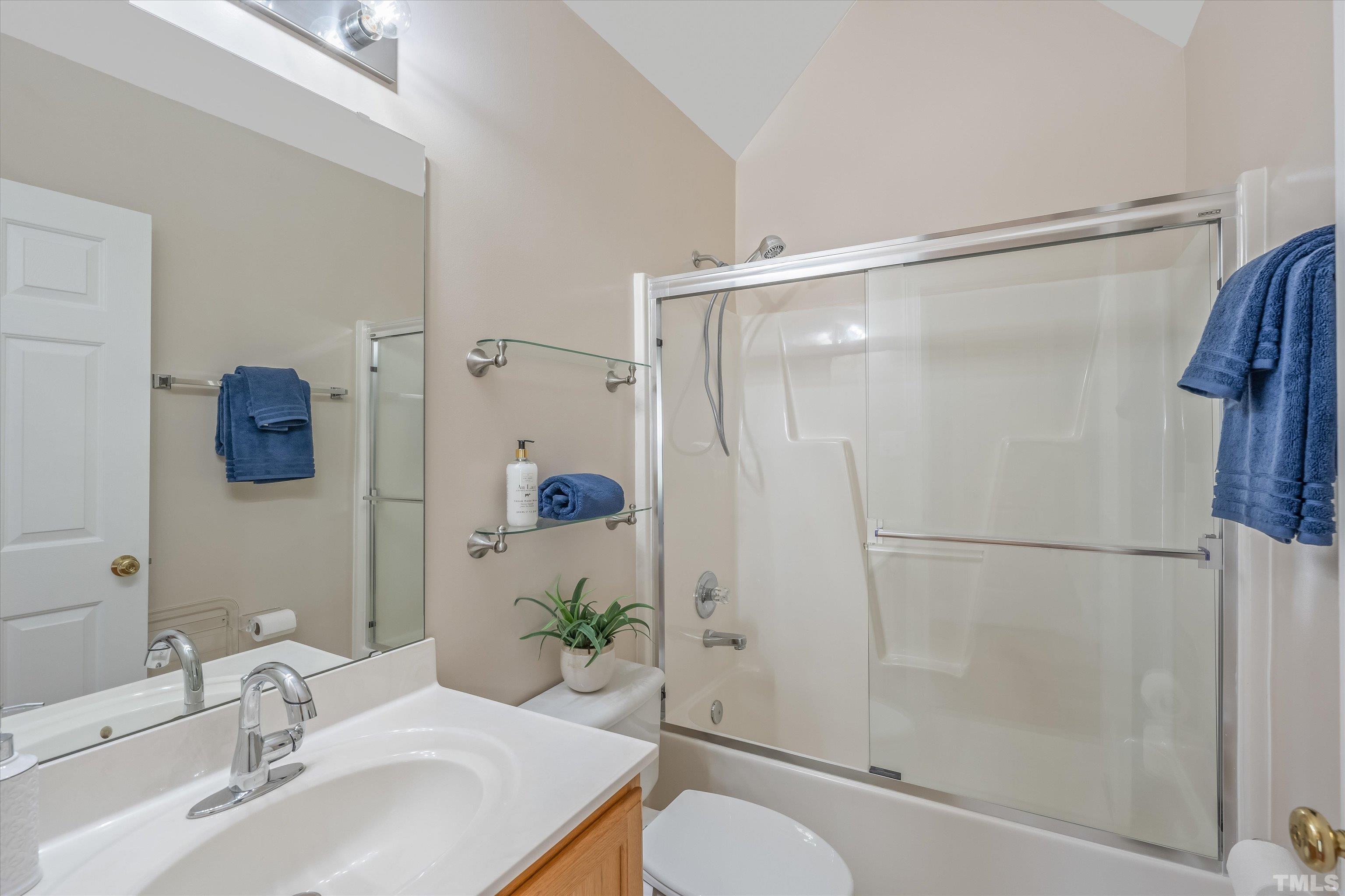 109 Rother Lane Durham, NC 27707 - Photo 17 of 25 a bathroom with a sink toilet and shower