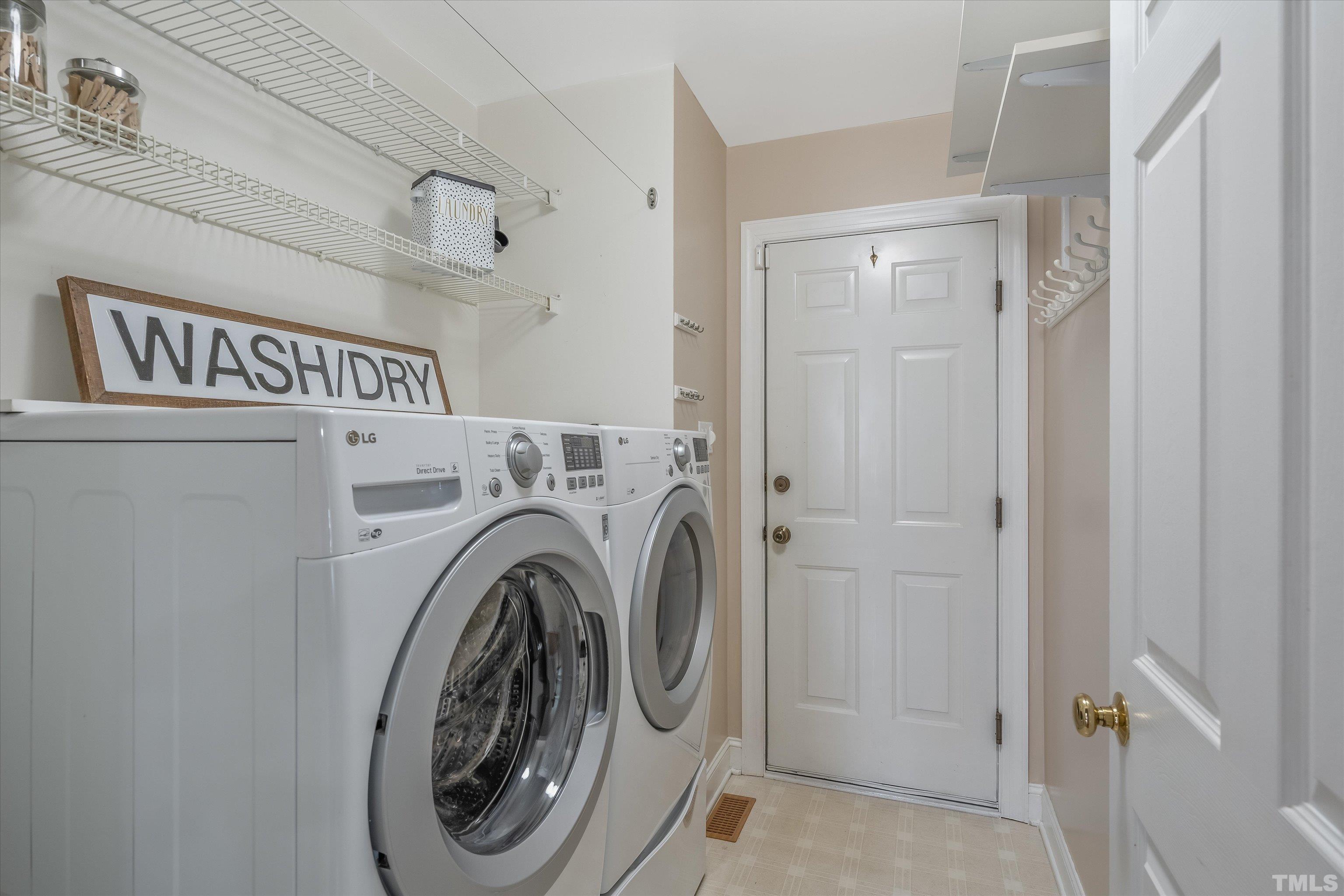 109 Rother Lane Durham, NC 27707 - Photo 19 of 25 a utility room with dryer and washer