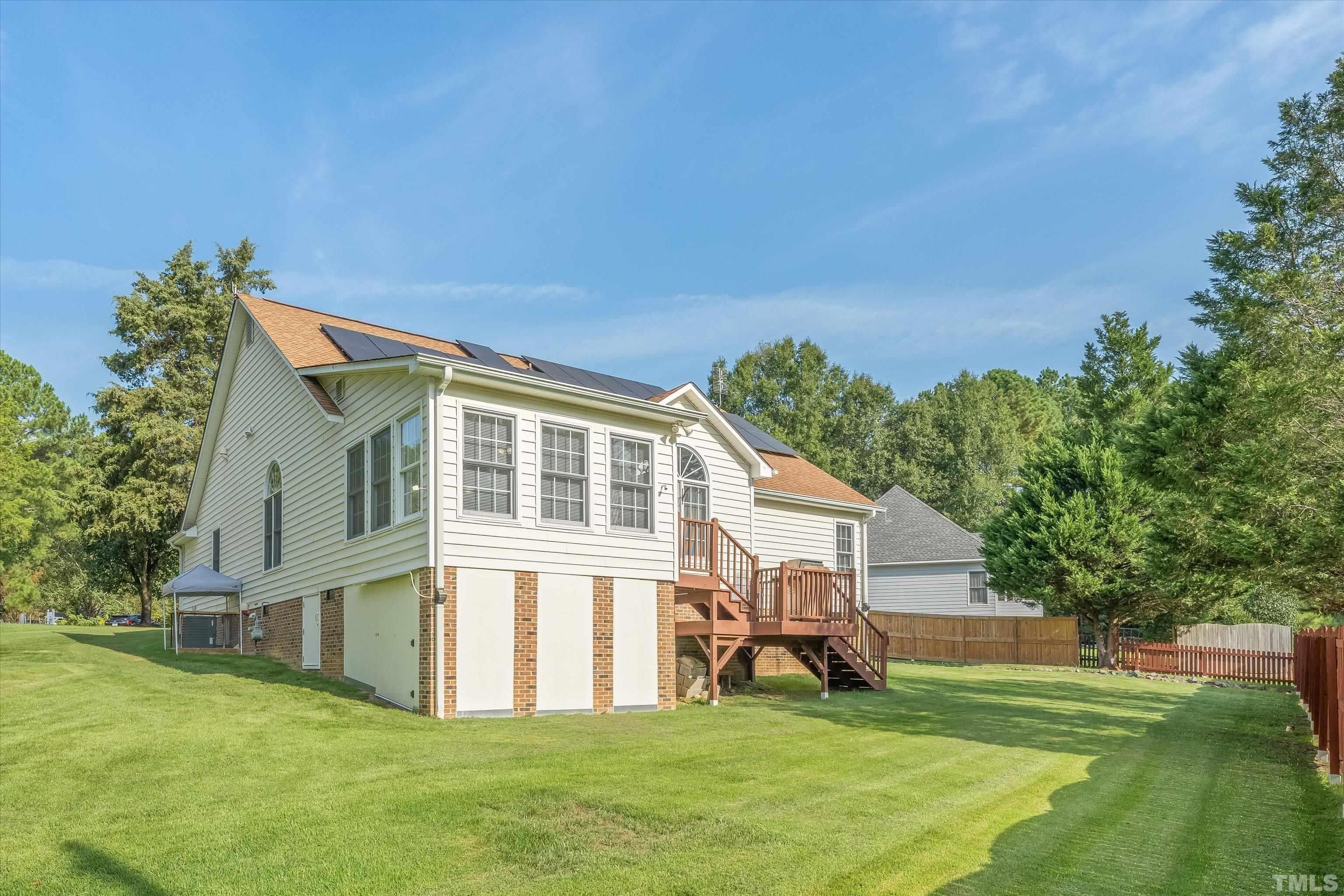 109 Rother Lane Durham, NC 27707 - Photo 24 of 25 a view of a house with a big yard and large trees