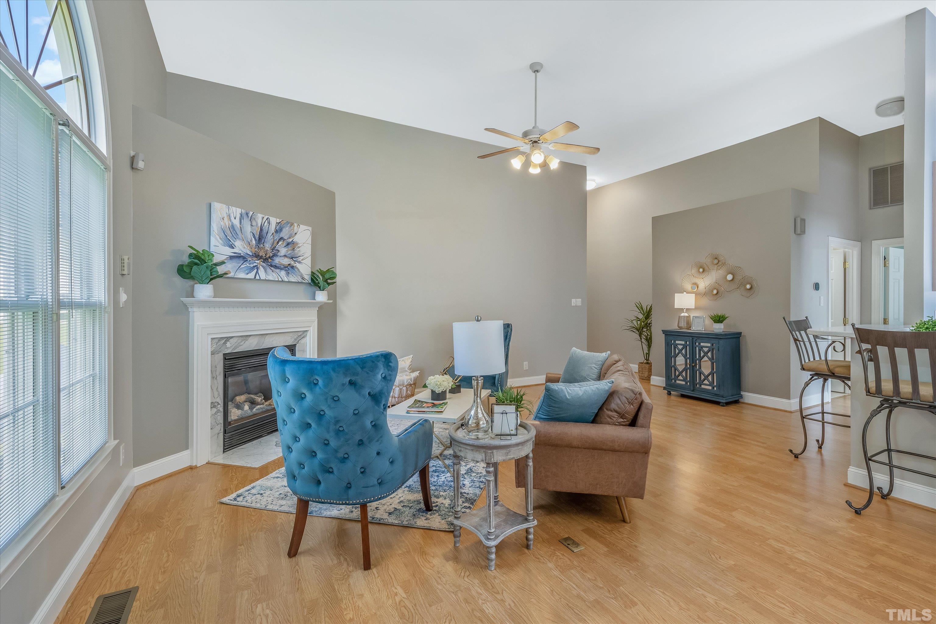 109 Rother Lane Durham, NC 27707 - Photo 4 of 25 a living room with furniture and a chandelier