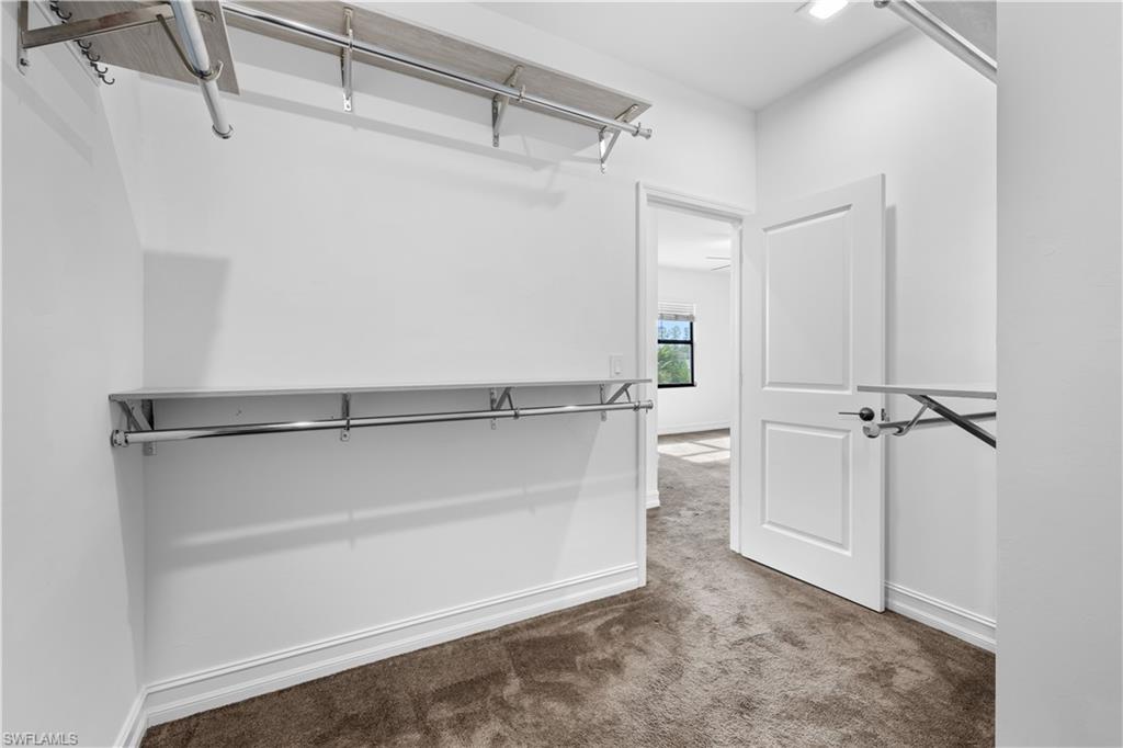 7548 Carnegie Way Naples, FL 34119 - Photo 13 of 20 Master walk-in closet