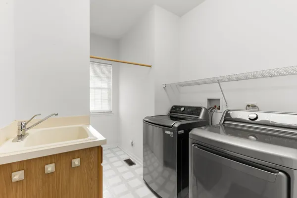 a utility room with dryer and washer