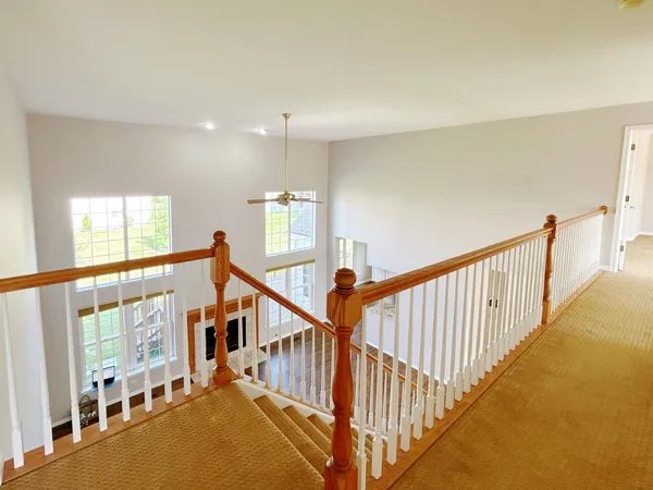 a view of an entryway with wooden floor