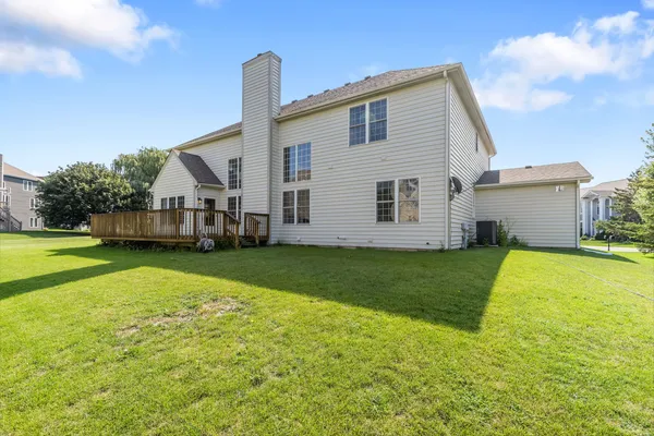a view of a house with a backyard
