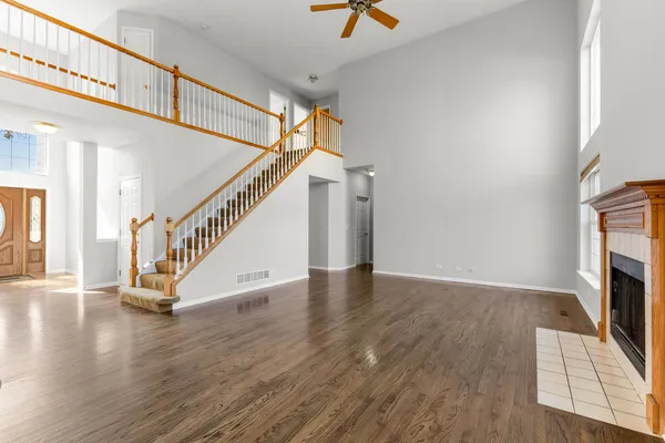 a view of an entryway with wooden floor