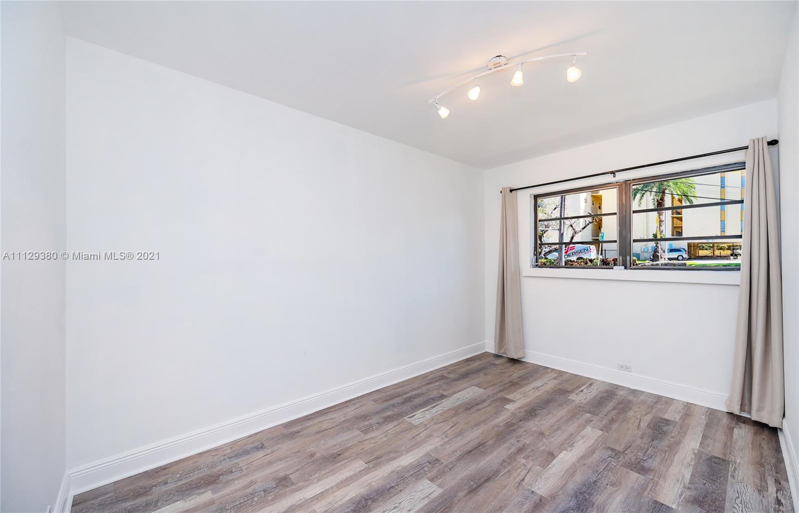 12480 Griffing Boulevard North Miami, FL 33161 - Photo 20 of 31 an empty room with a window