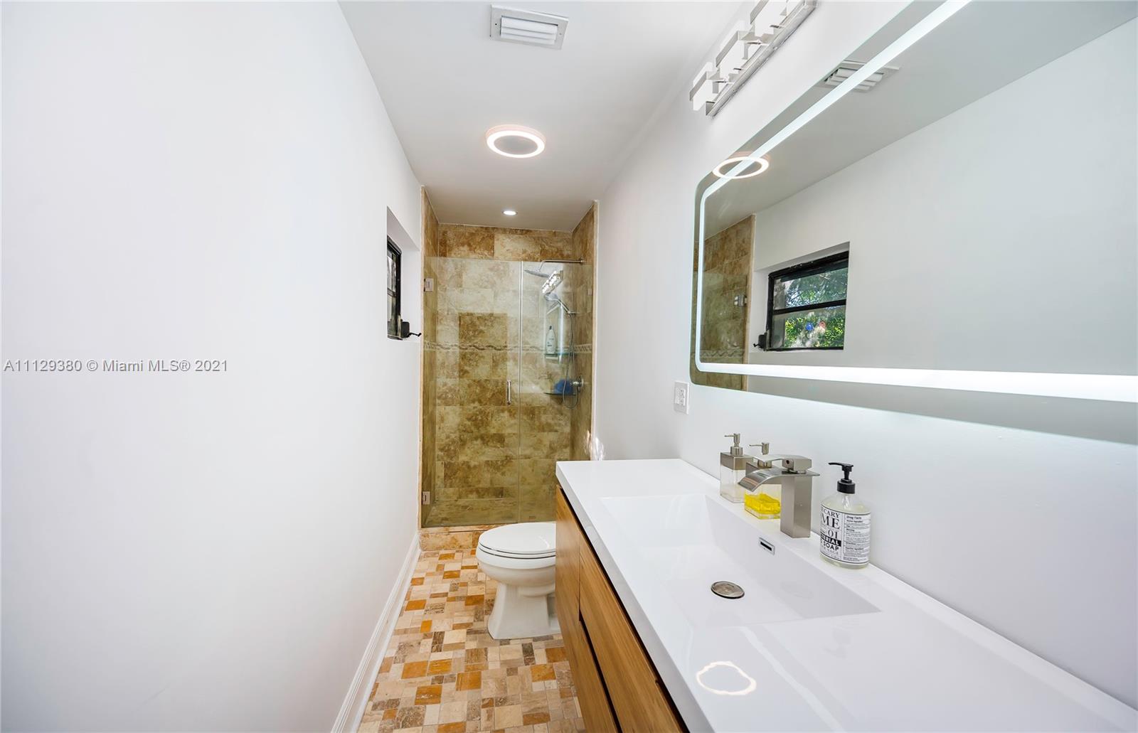 12480 Griffing Boulevard North Miami, FL 33161 - Photo 25 of 31 a bath room with a sink and a bath tub