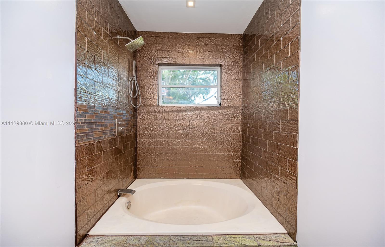 12480 Griffing Boulevard North Miami, FL 33161 - Photo 28 of 31 view of a bathroom with a bathtub