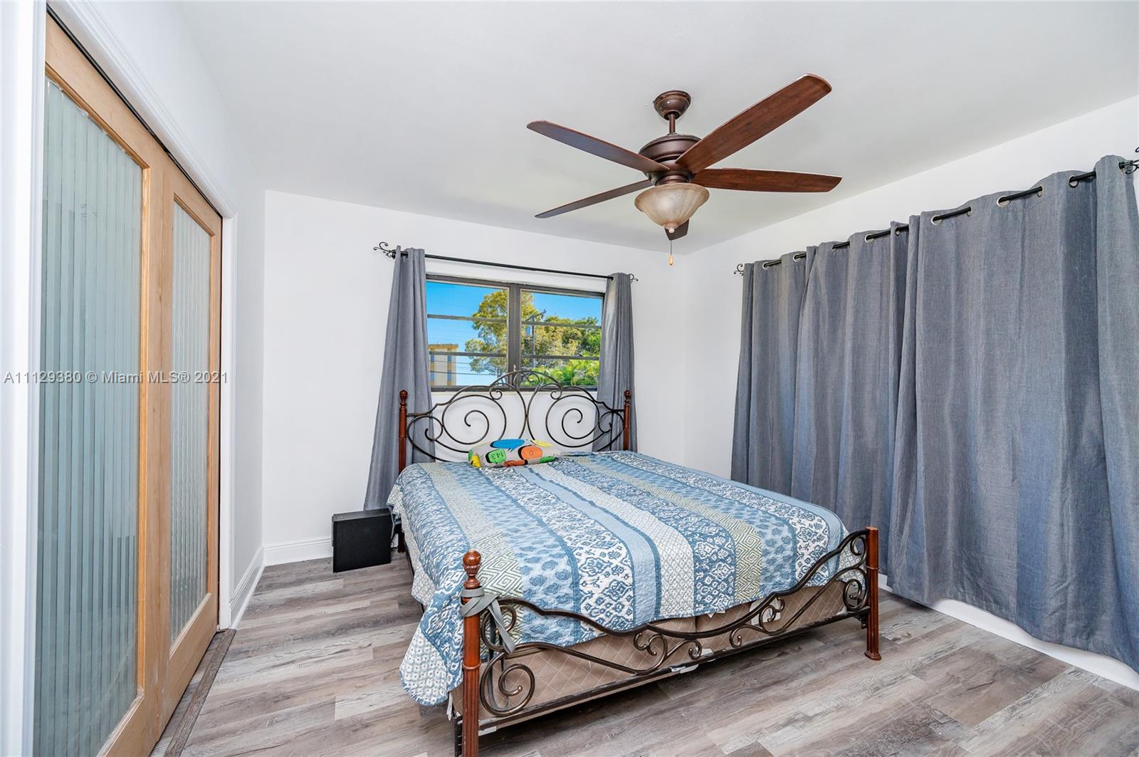 12480 Griffing Boulevard North Miami, FL 33161 - Photo 29 of 31 a bedroom with a bed and a window