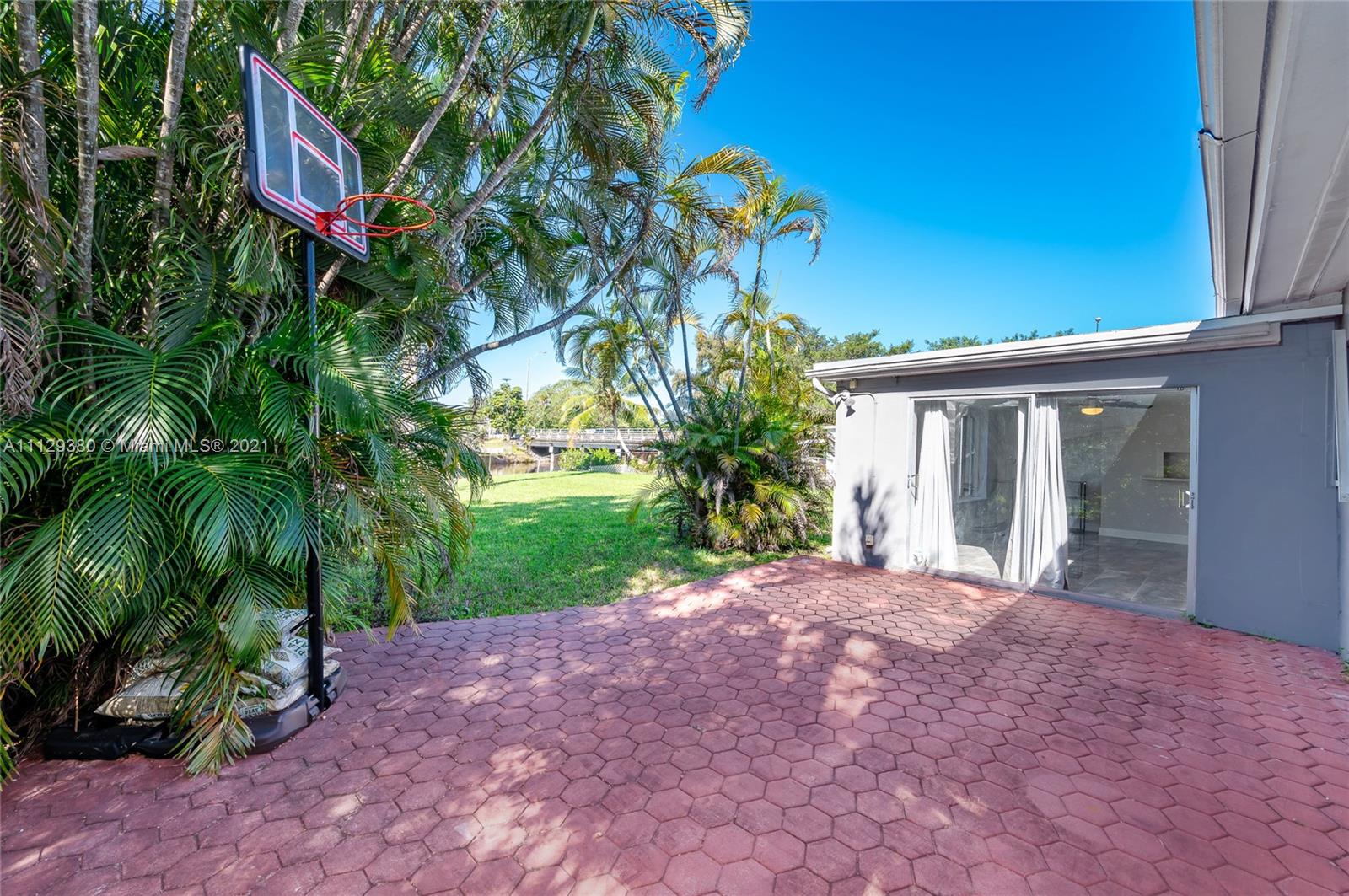 12480 Griffing Boulevard North Miami, FL 33161 - Photo 8 of 31 a house view with a backyard space