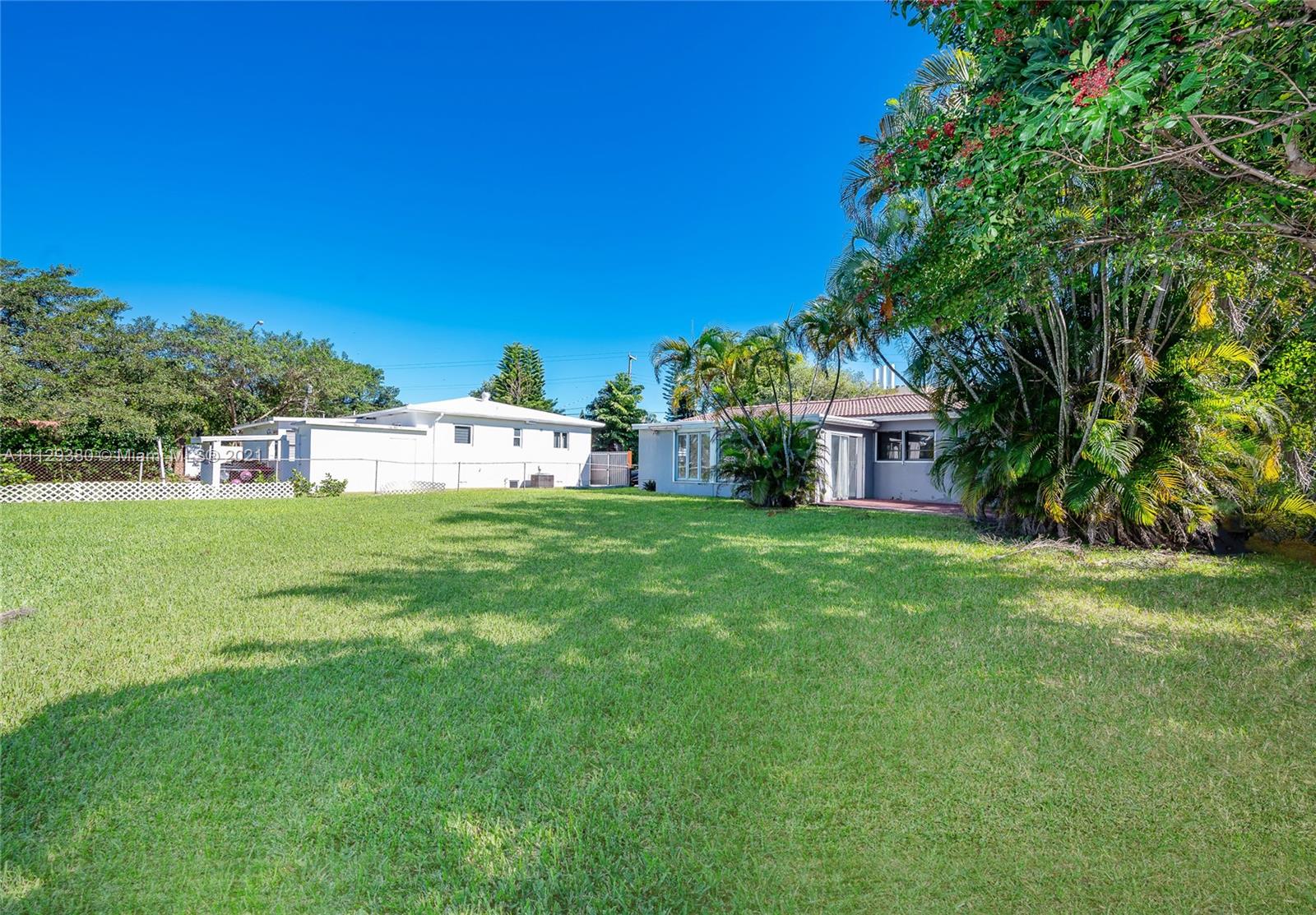 12480 Griffing Boulevard North Miami, FL 33161 - Photo 10 of 31 a view of a house with a yard