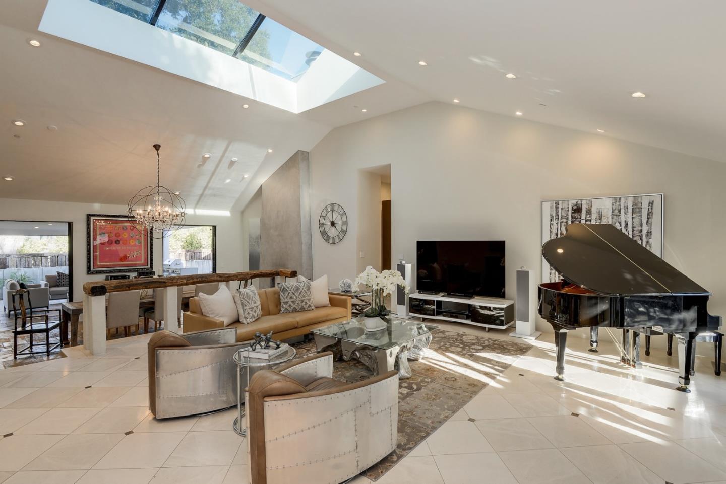 14480 Oak Place Saratoga, CA 95070 - Photo 2 of 45 a living room with furniture and a flat screen tv