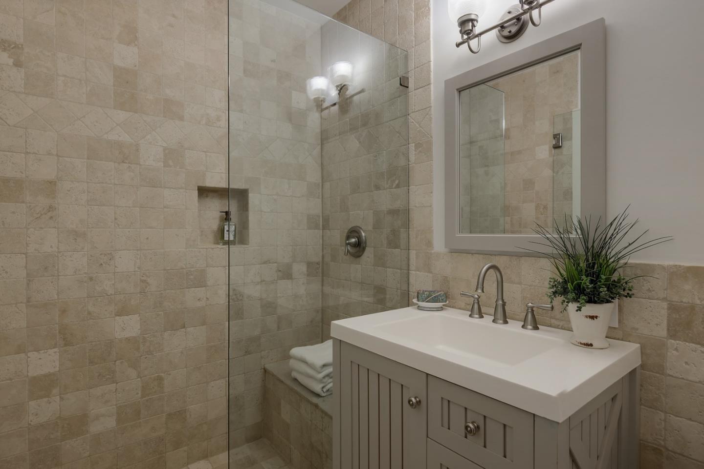14480 Oak Place Saratoga, CA 95070 - Photo 14 of 45 a bathroom with a sink a mirror and a shower
