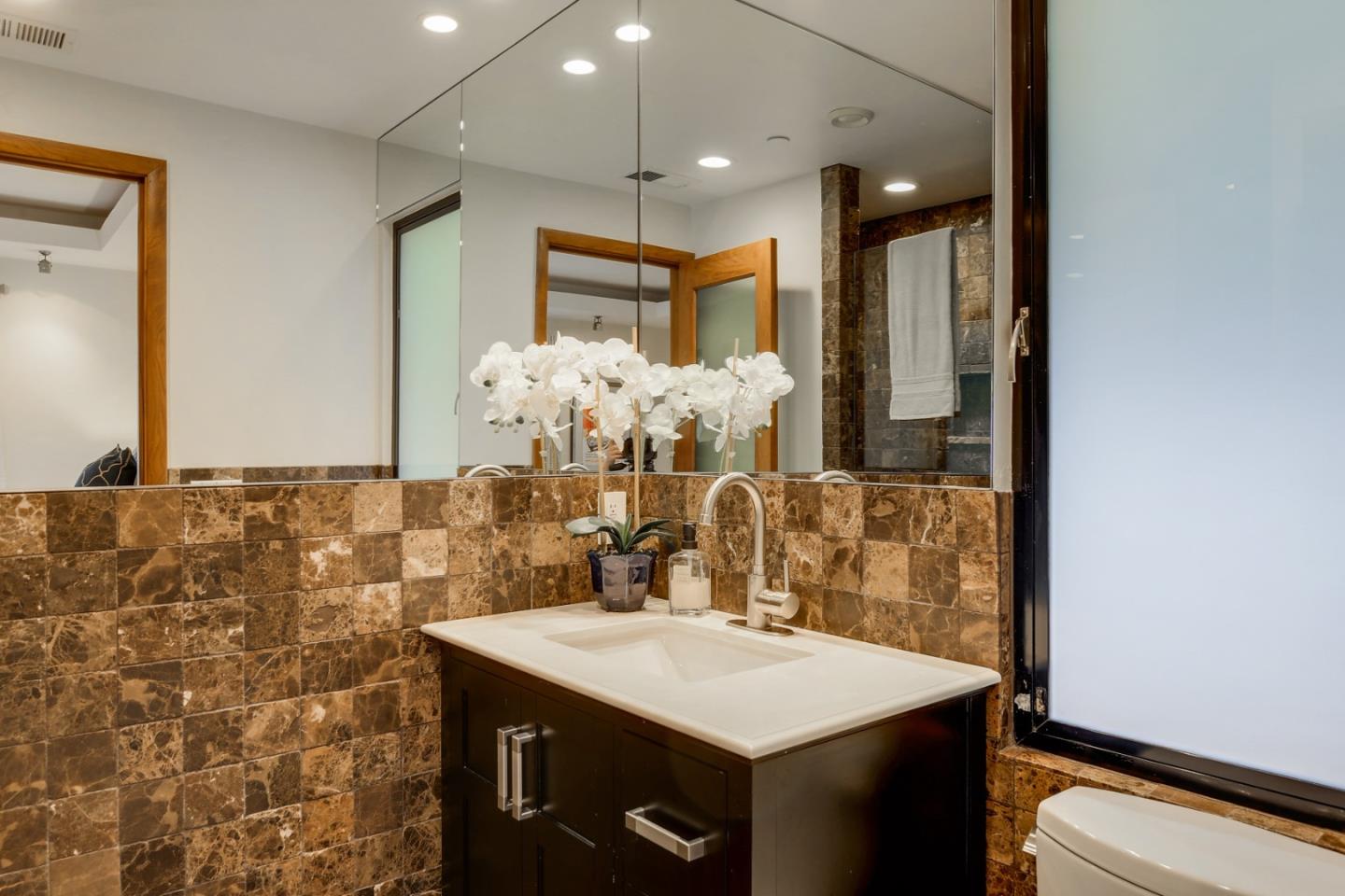 14480 Oak Place Saratoga, CA 95070 - Photo 22 of 45 a bathroom with a sink vanity and a mirror