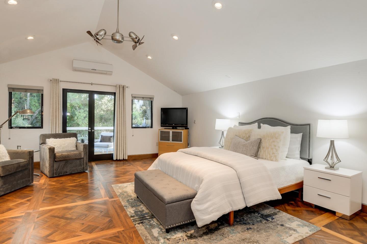 14480 Oak Place Saratoga, CA 95070 - Photo 32 of 45 a spacious bedroom with a bed a couch and large window