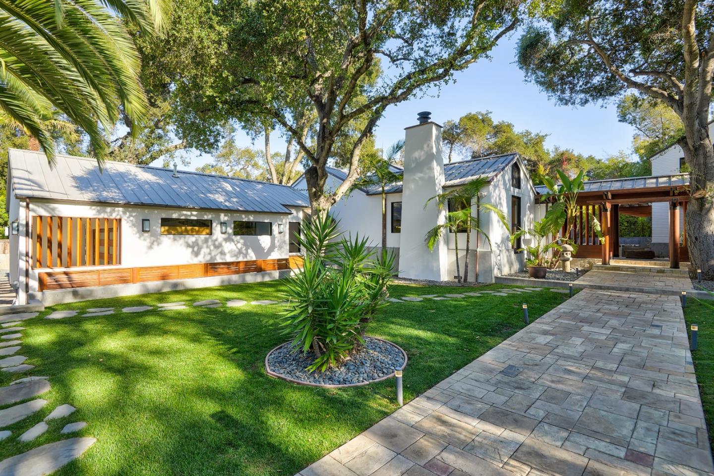 14480 Oak Place Saratoga, CA 95070 - Photo 39 of 45 a view of a house with a small yard and a large tree