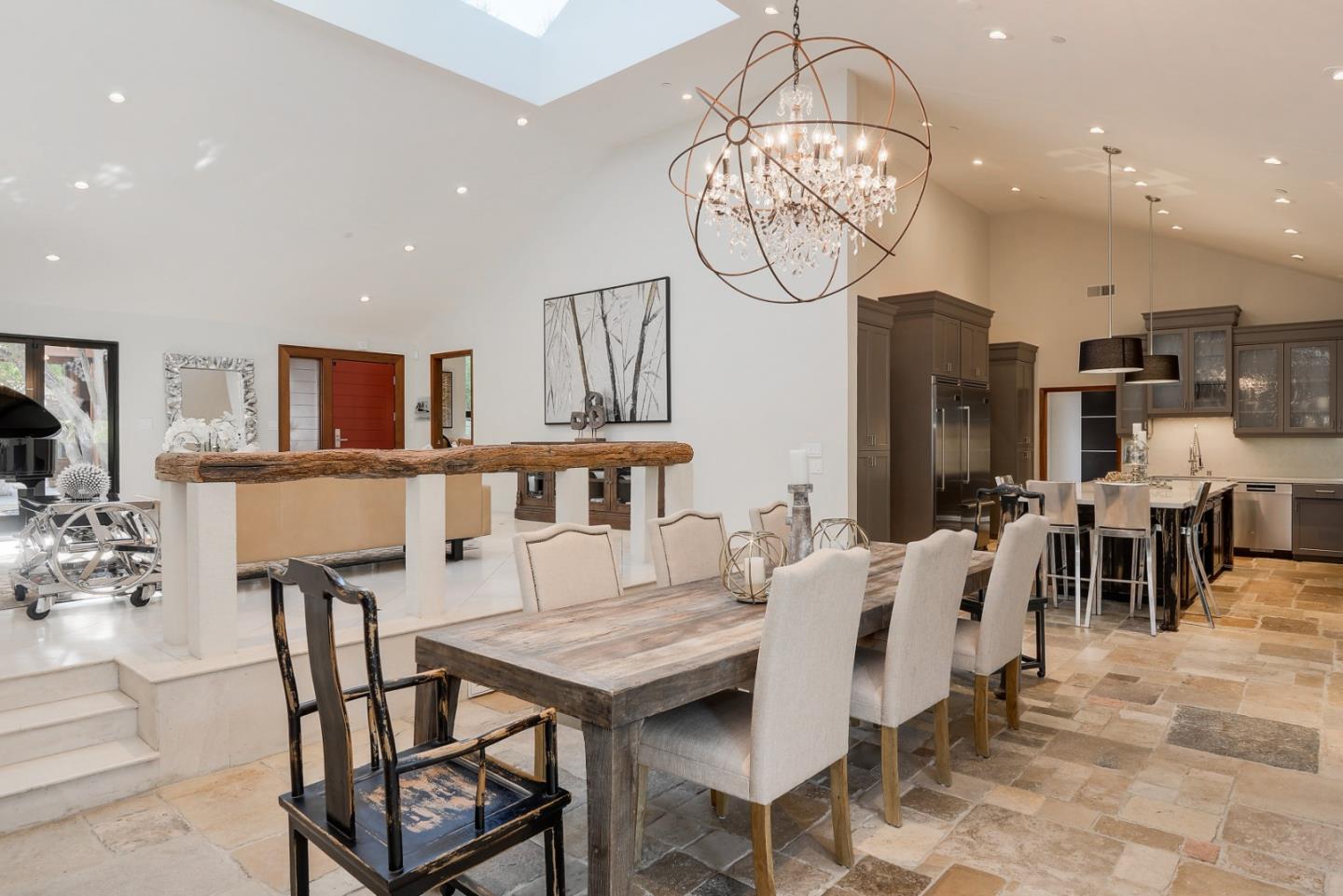 14480 Oak Place Saratoga, CA 95070 - Photo 5 of 45 a view of a dining room and livingroom with furniture a rug a chandelier and a view