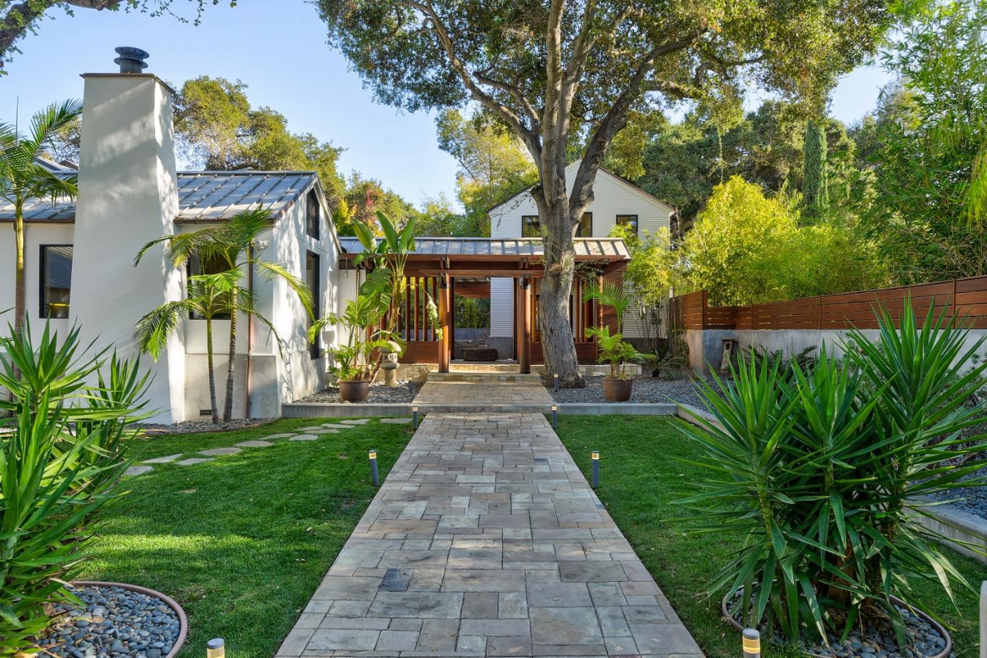 14480 Oak Place Saratoga, CA 95070 - Photo 41 of 45 a front view of a house with a garden