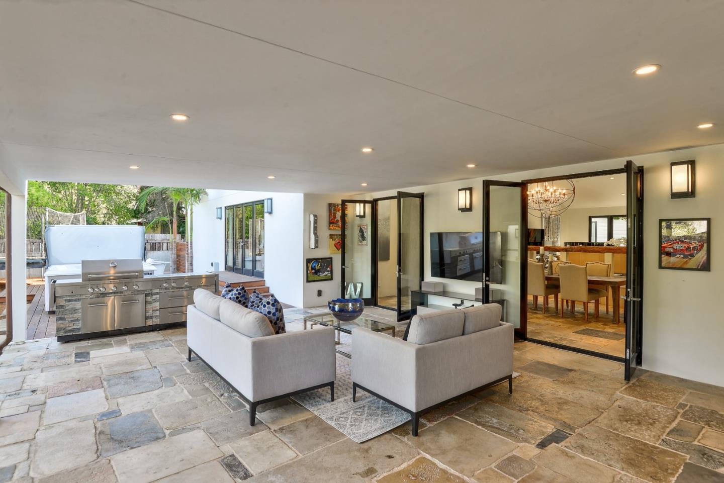 14480 Oak Place Saratoga, CA 95070 - Photo 8 of 45 a living room with furniture and large glass door