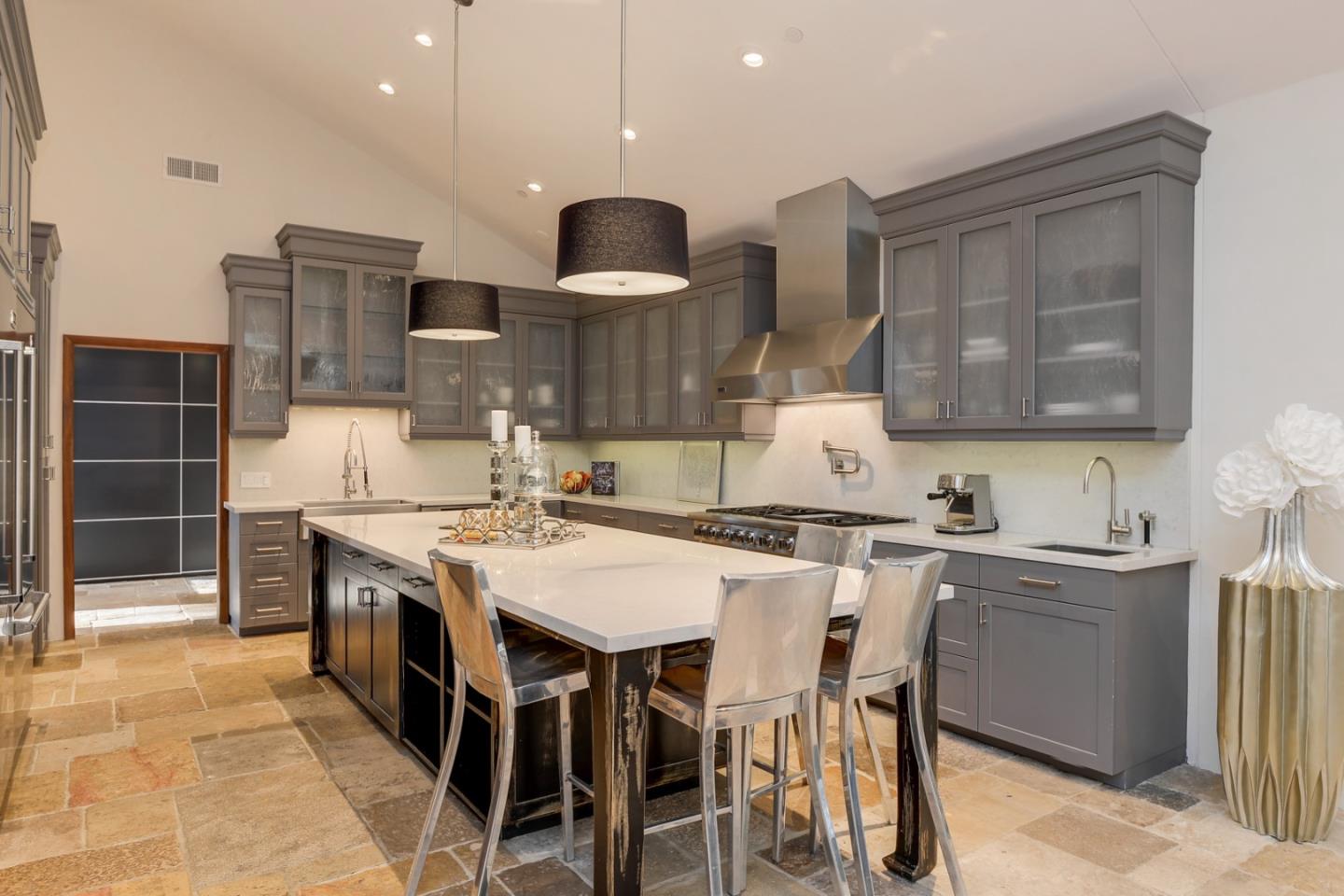 14480 Oak Place Saratoga, CA 95070 - Photo 10 of 45 a kitchen with kitchen island granite countertop a sink and a stove