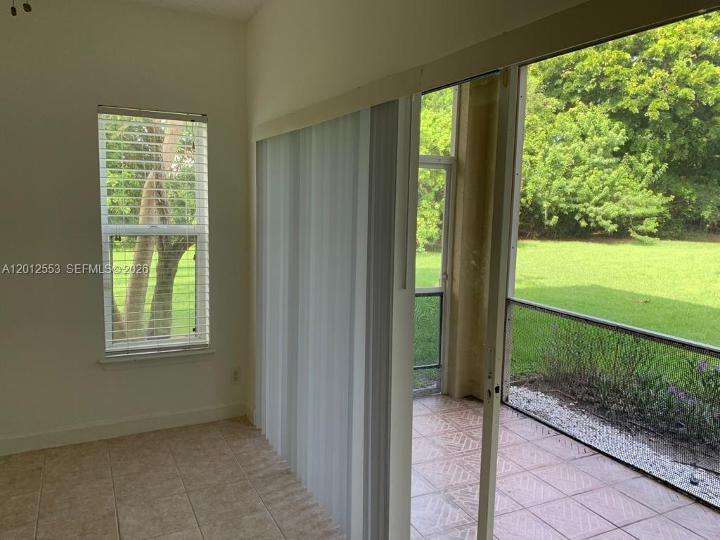 6975 Blacksmith Way Lake Worth, FL 33467 - Photo 11 of 21 a view of a room that has a large window