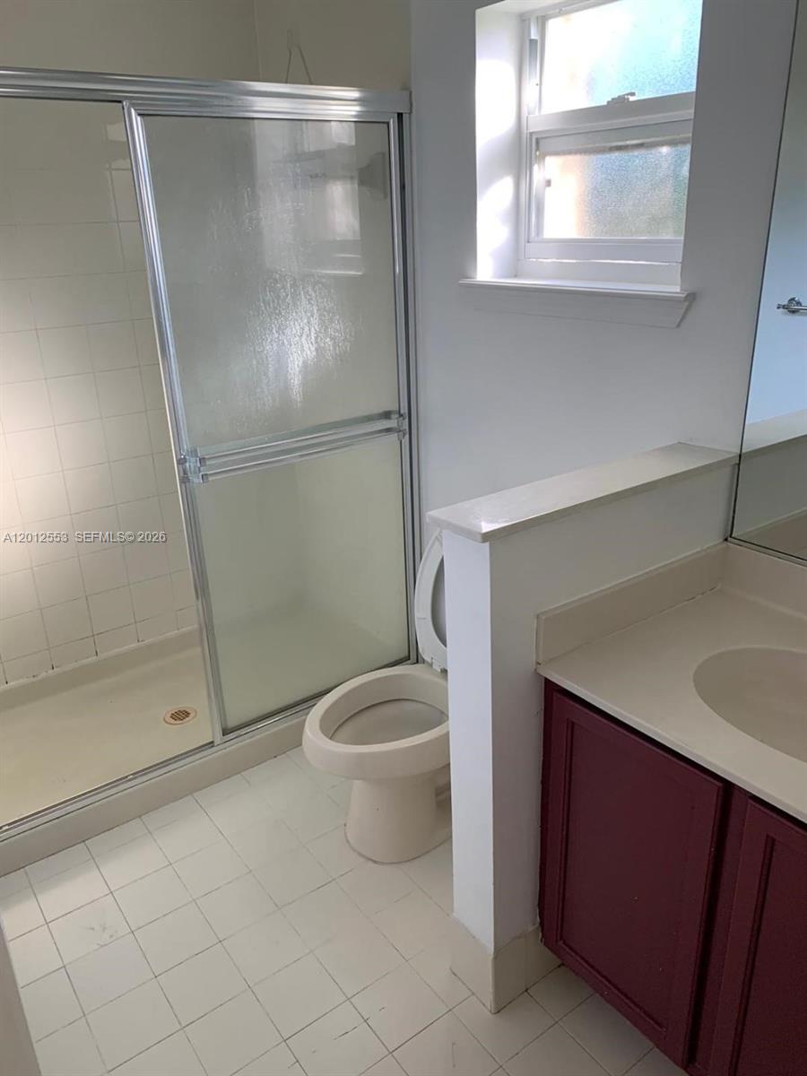 6975 Blacksmith Way Lake Worth, FL 33467 - Photo 15 of 21 a bathroom with a granite countertop sink toilet and shower