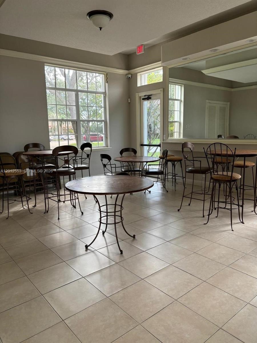 6975 Blacksmith Way Lake Worth, FL 33467 - Photo 19 of 21 a view of a dining room with furniture and window