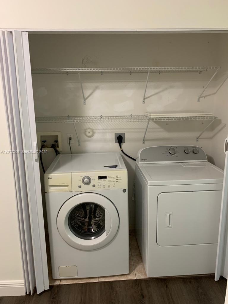 6975 Blacksmith Way Lake Worth, FL 33467 - Photo 7 of 21 a utility room with dryer and washer