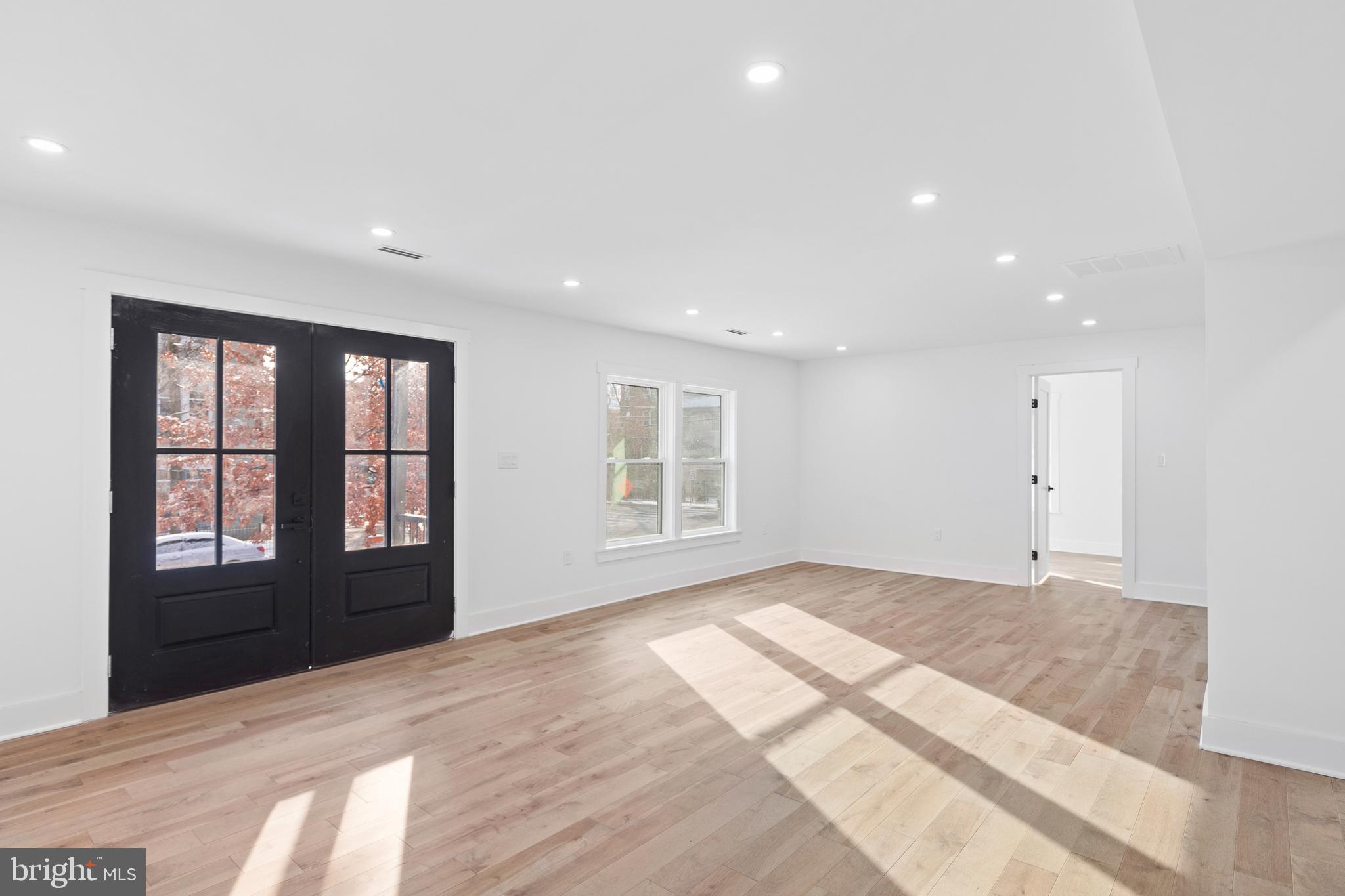 1355 Longfellow Street Northwest Washington, DC 20011 - Photo 14 of 37 a view of a livingroom with a ceiling fan and window