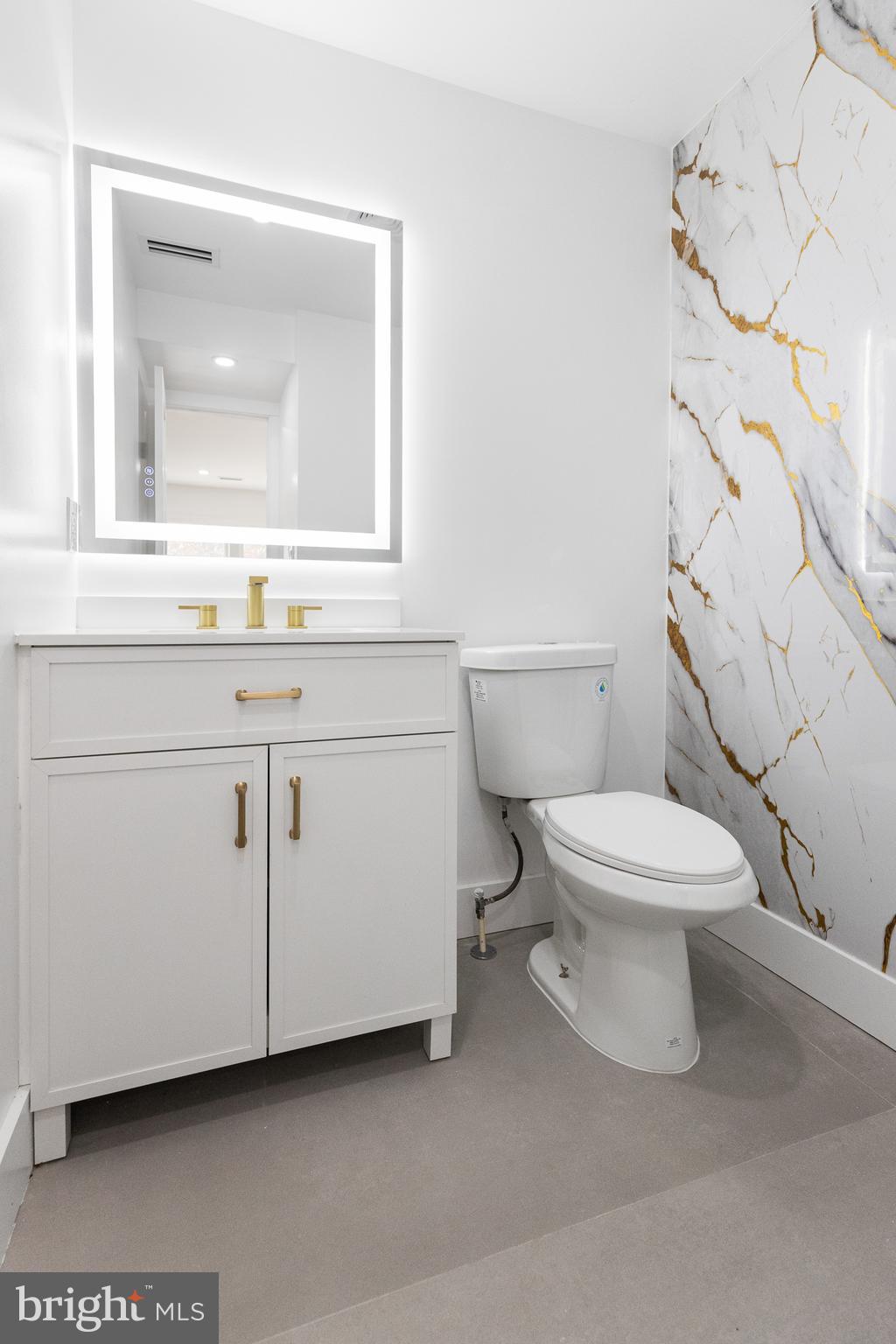 1355 Longfellow Street Northwest Washington, DC 20011 - Photo 15 of 37 a bathroom with a toilet sink and mirror