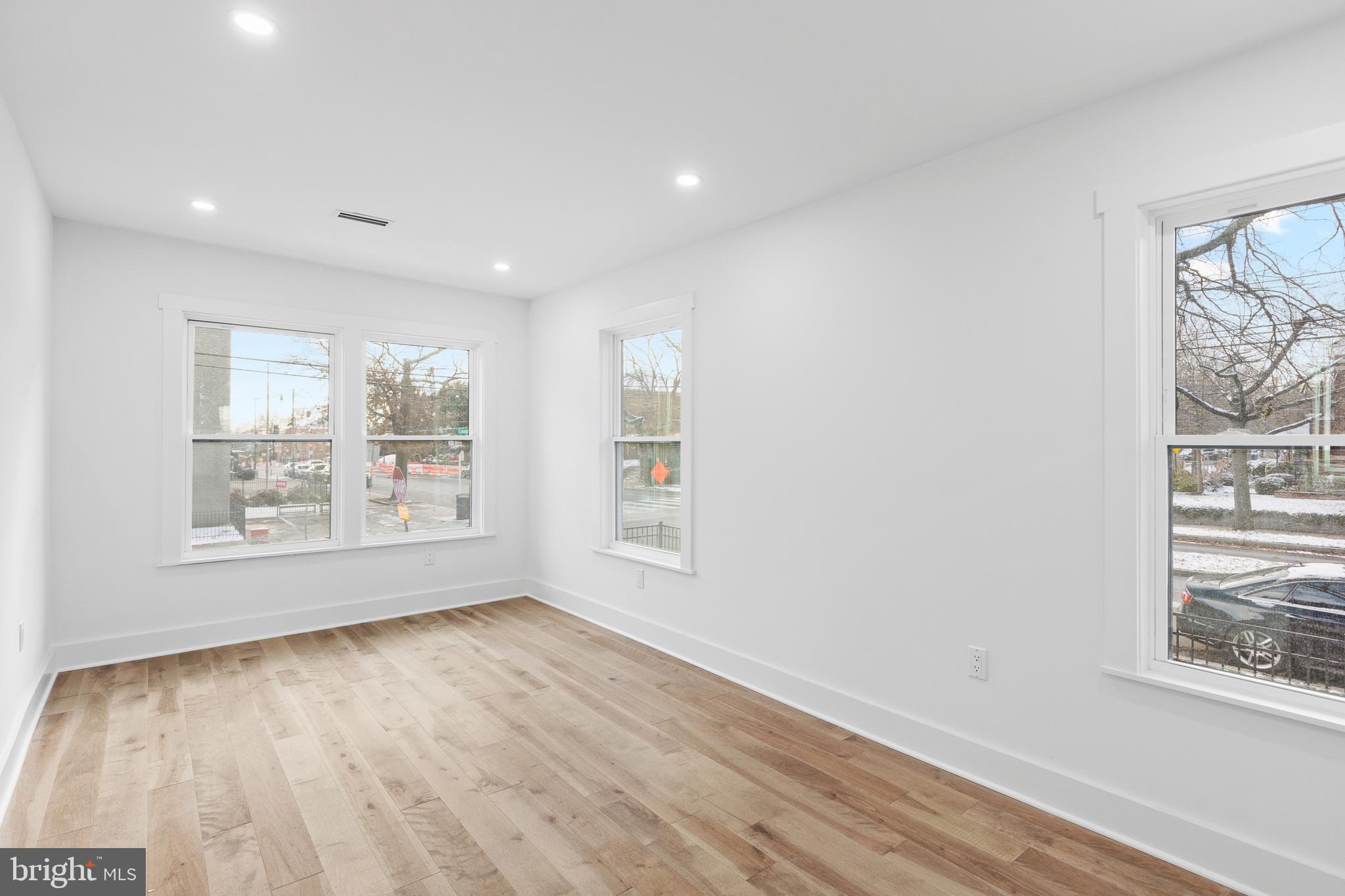 1355 Longfellow Street Northwest Washington, DC 20011 - Photo 17 of 37 a view of an empty room with wooden floor and a window