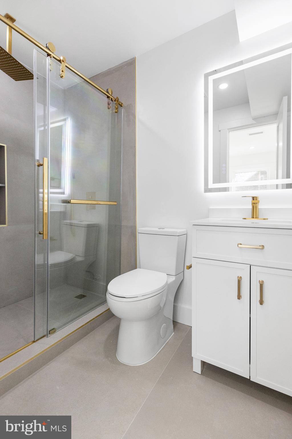 1355 Longfellow Street Northwest Washington, DC 20011 - Photo 18 of 37 a bathroom with a toilet sink and a shower