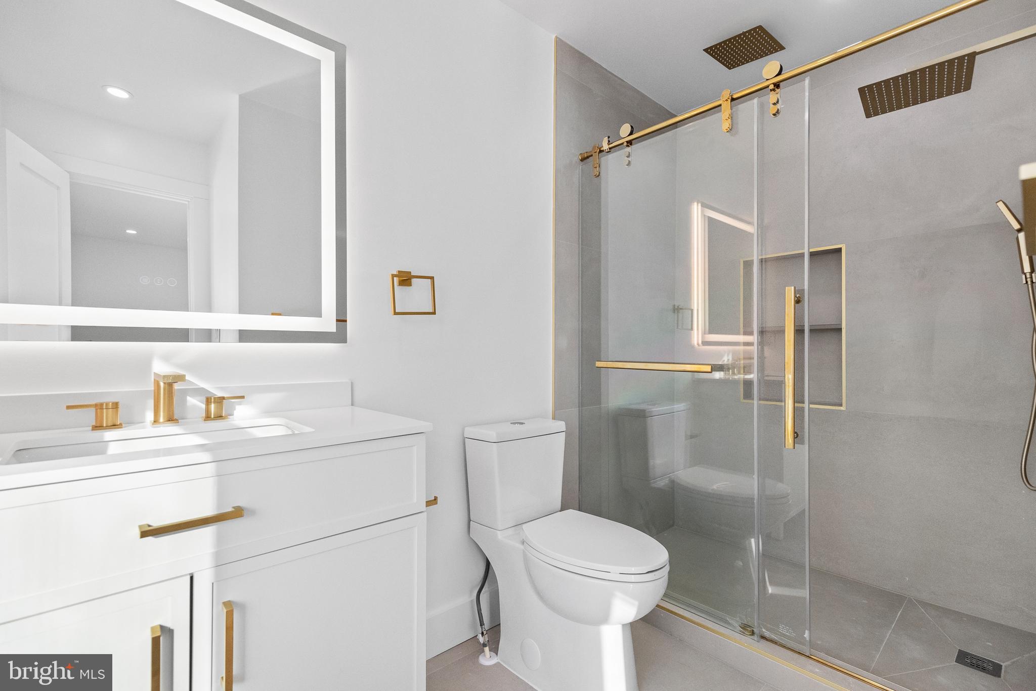 1355 Longfellow Street Northwest Washington, DC 20011 - Photo 22 of 37 a bathroom with a sink toilet and shower