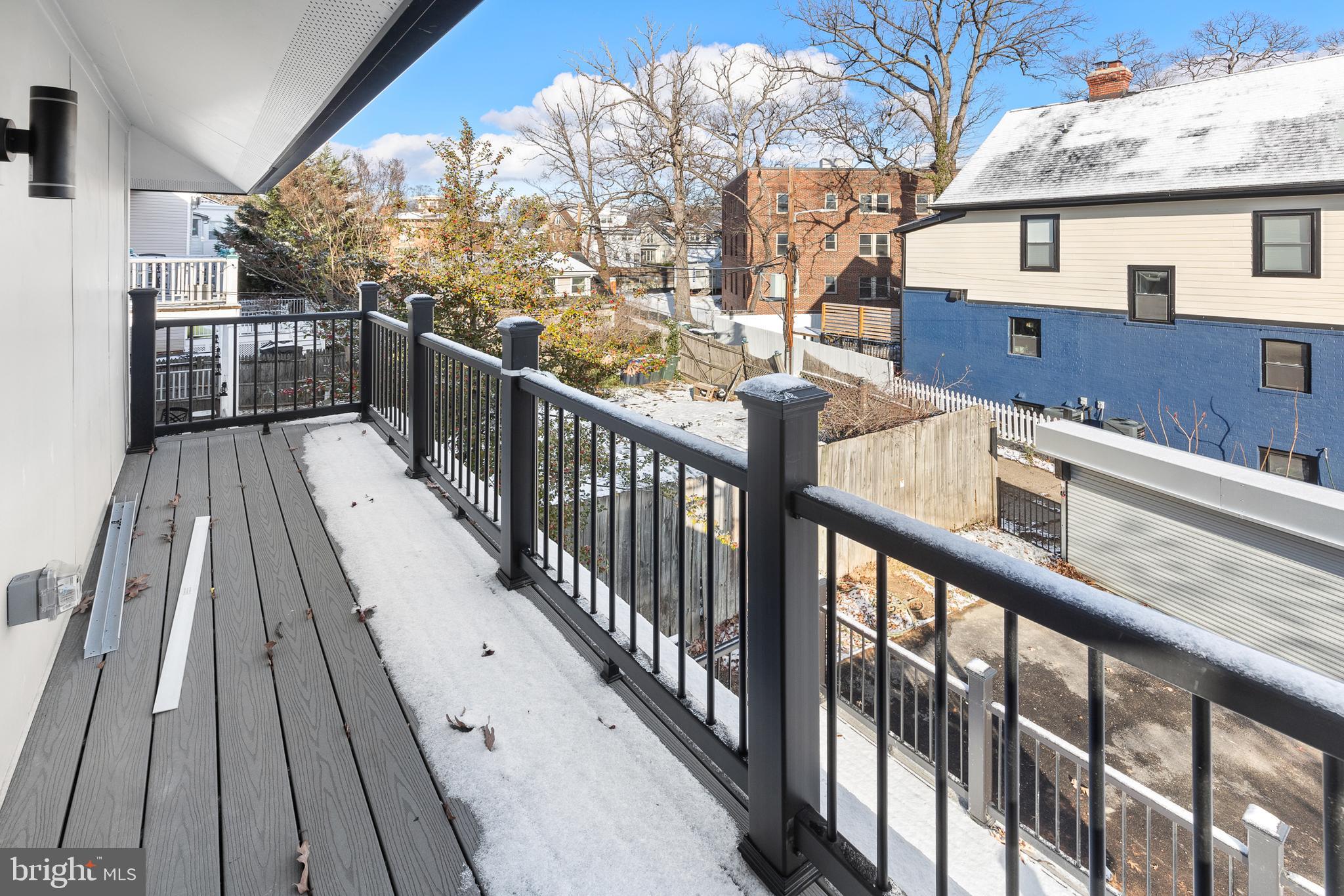 1355 Longfellow Street Northwest Washington, DC 20011 - Photo 25 of 37 a view of a balcony with wooden floor and fence