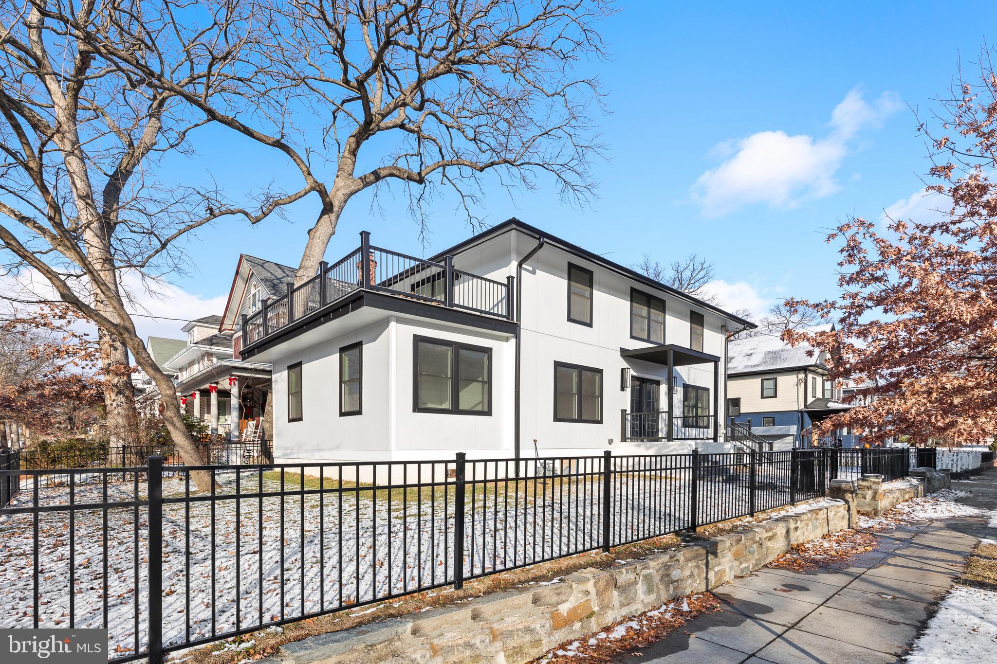 1355 Longfellow Street Northwest Washington, DC 20011 - Photo 3 of 37 a front view of a house with a yard