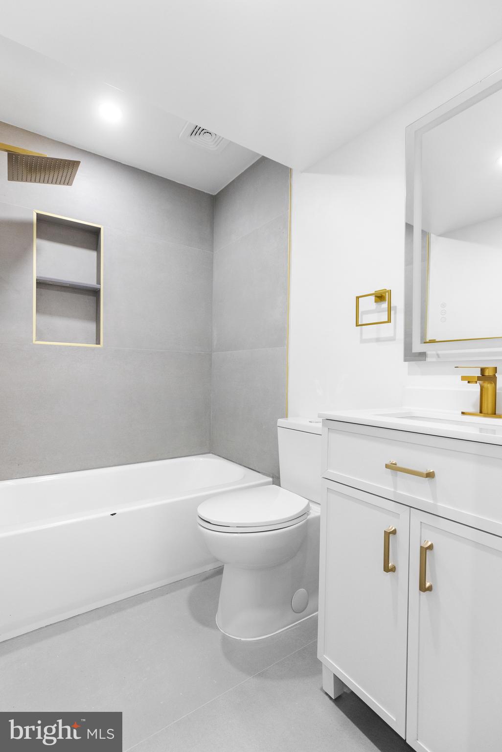 1355 Longfellow Street Northwest Washington, DC 20011 - Photo 33 of 37 a bathroom with a sink a toilet and vanity