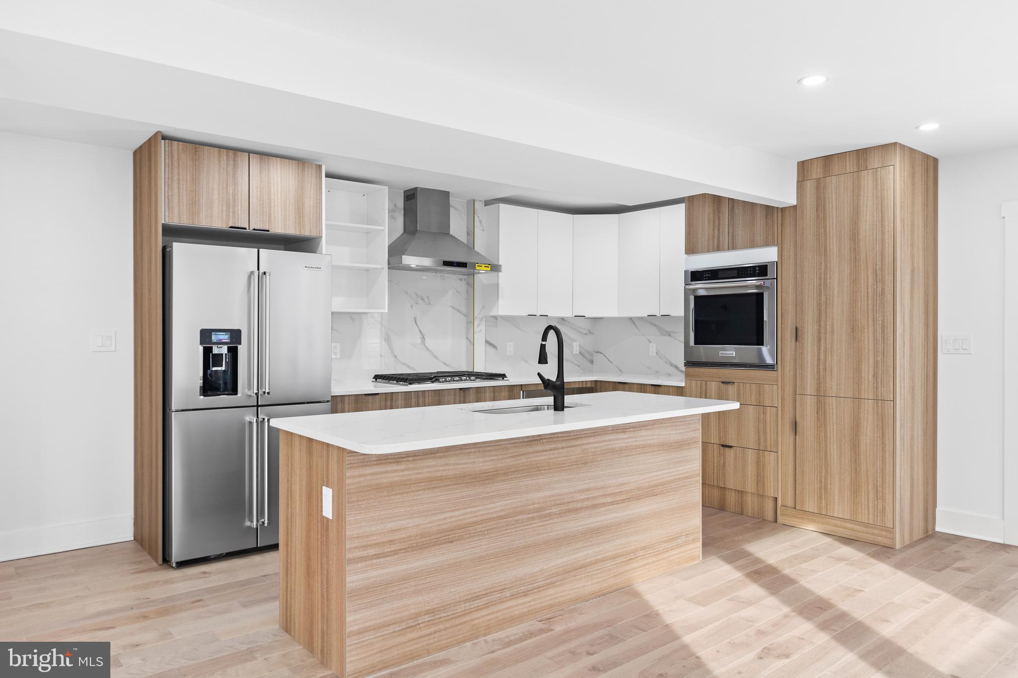 1355 Longfellow Street Northwest Washington, DC 20011 - Photo 8 of 37 a kitchen with stainless steel appliances granite countertop a refrigerator a sink and a stove