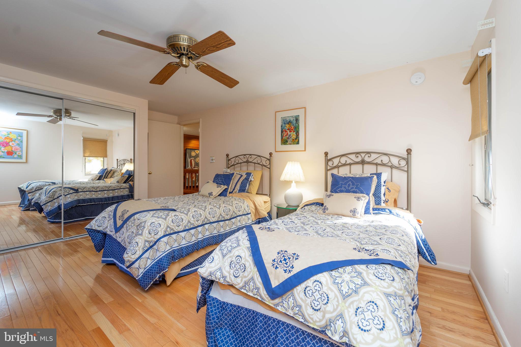 1737 Point Drive, Unit POINT Annapolis, MD 21401 - Photo 16 of 22 a bedroom with a bed and wooden floor