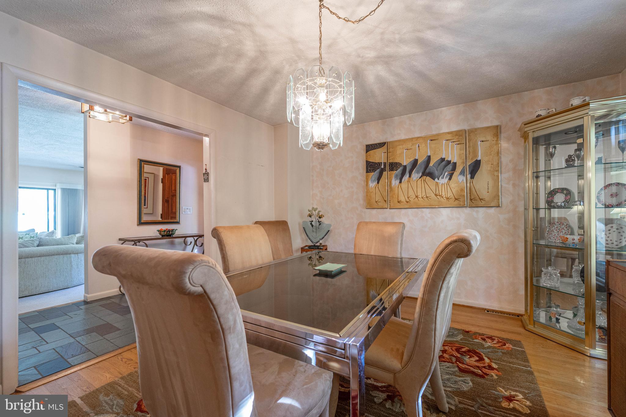 1737 Point Drive, Unit POINT Annapolis, MD 21401 - Photo 2 of 22 a view of a dining room with furniture window and wooden floor