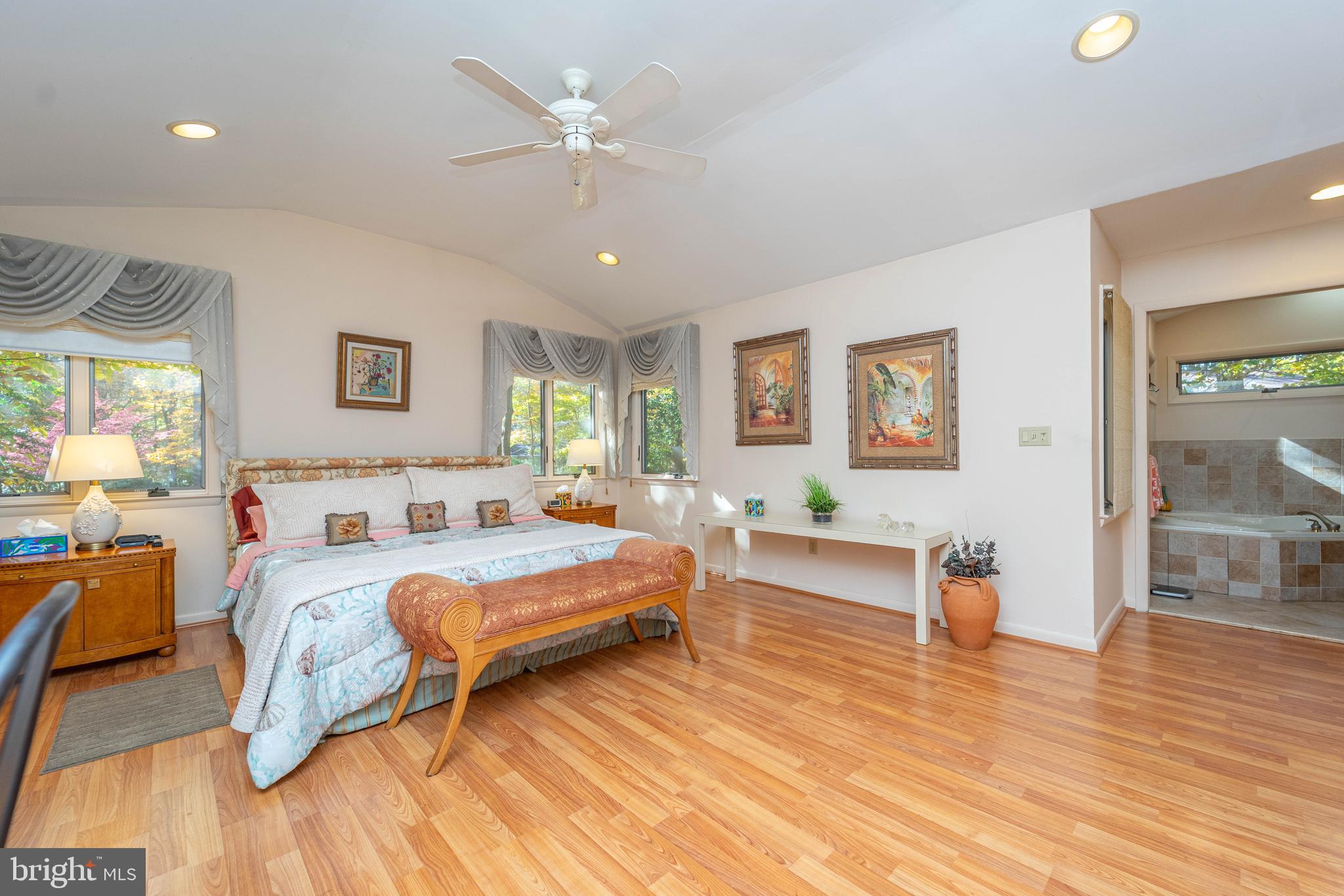 1737 Point Drive, Unit POINT Annapolis, MD 21401 - Photo 7 of 22 a bedroom with a bed couches and wooden floor