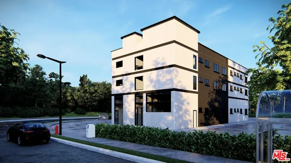 a front view of a building with plants