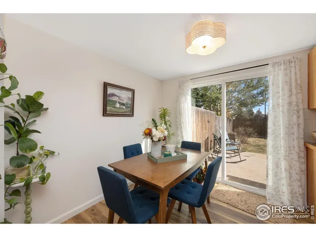 a dining room with a table and chairs