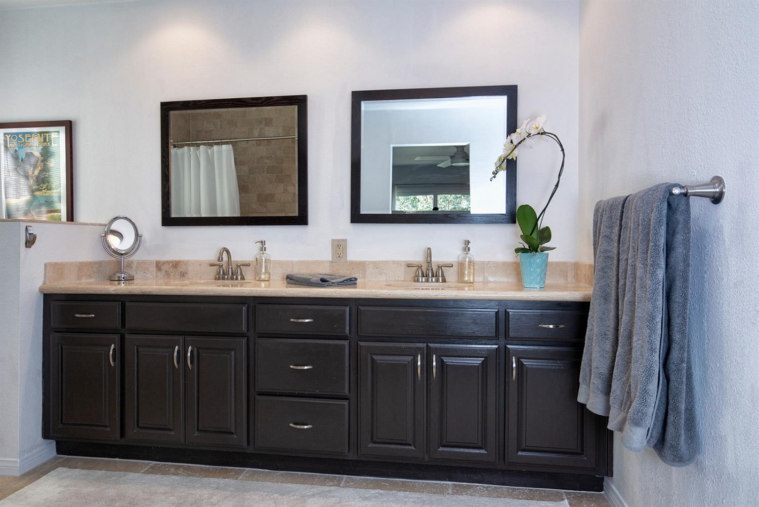 1310 Daly Road Ojai, CA 93023 - Photo 11 of 18 a bathroom with a double vanity sink and a mirror
