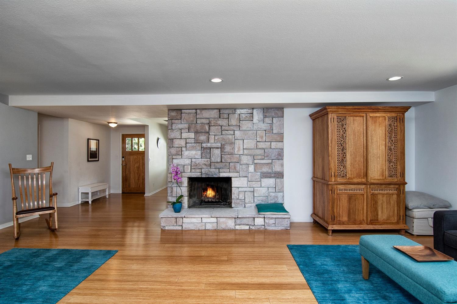 1310 Daly Road Ojai, CA 93023 - Photo 4 of 18 a living room with furniture wooden floor and a fireplace