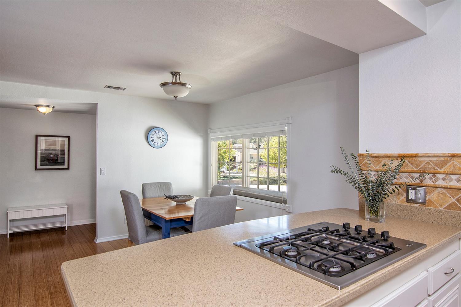 1310 Daly Road Ojai, CA 93023 - Photo 7 of 18 a kitchen with a stove and wooden floor