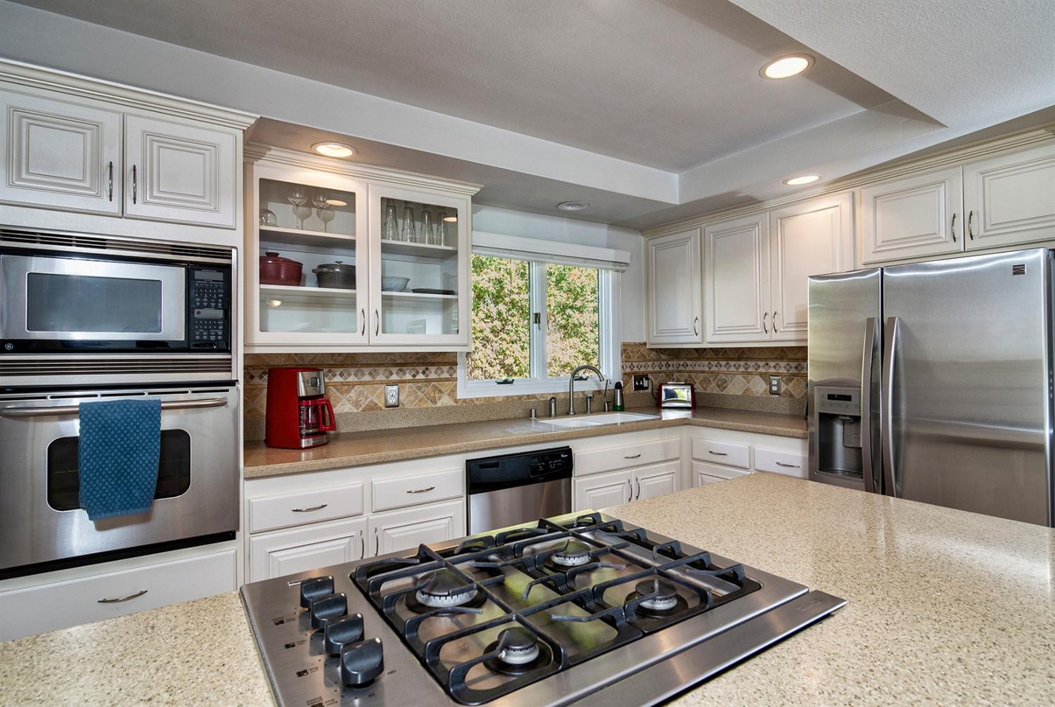 1310 Daly Road Ojai, CA 93023 - Photo 8 of 18 a kitchen with stainless steel appliances a stove a sink and a microwave