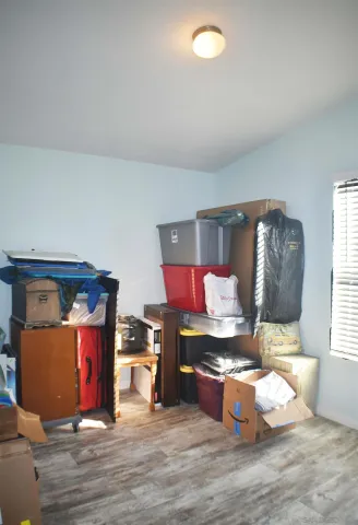 a room with furniture and flat screen tv